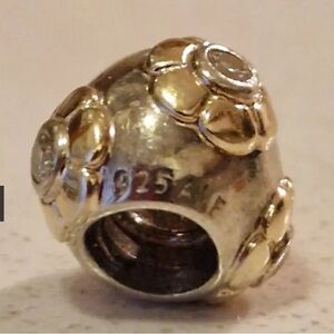 Pandora, Sterling and 14 karat gold raised flower charm
